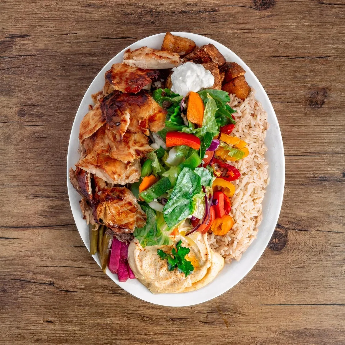Chicken shawarma platter with rice, hummus and salad