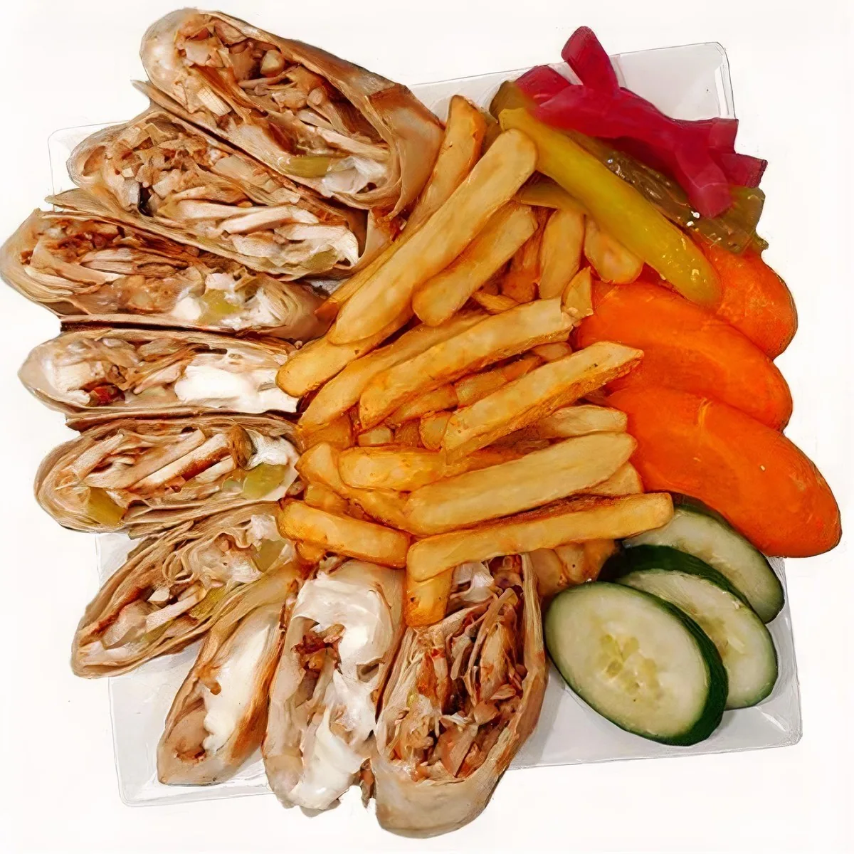 Sliced saj shawarma sandwiches with fries and pickles